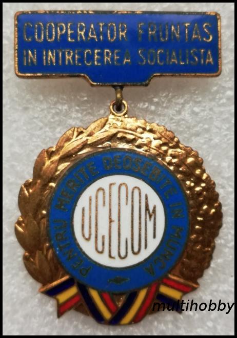 Insigna - Cooperator fruntas in intrecerea socialista - Pentru merite deosebite in munca - UCECOM